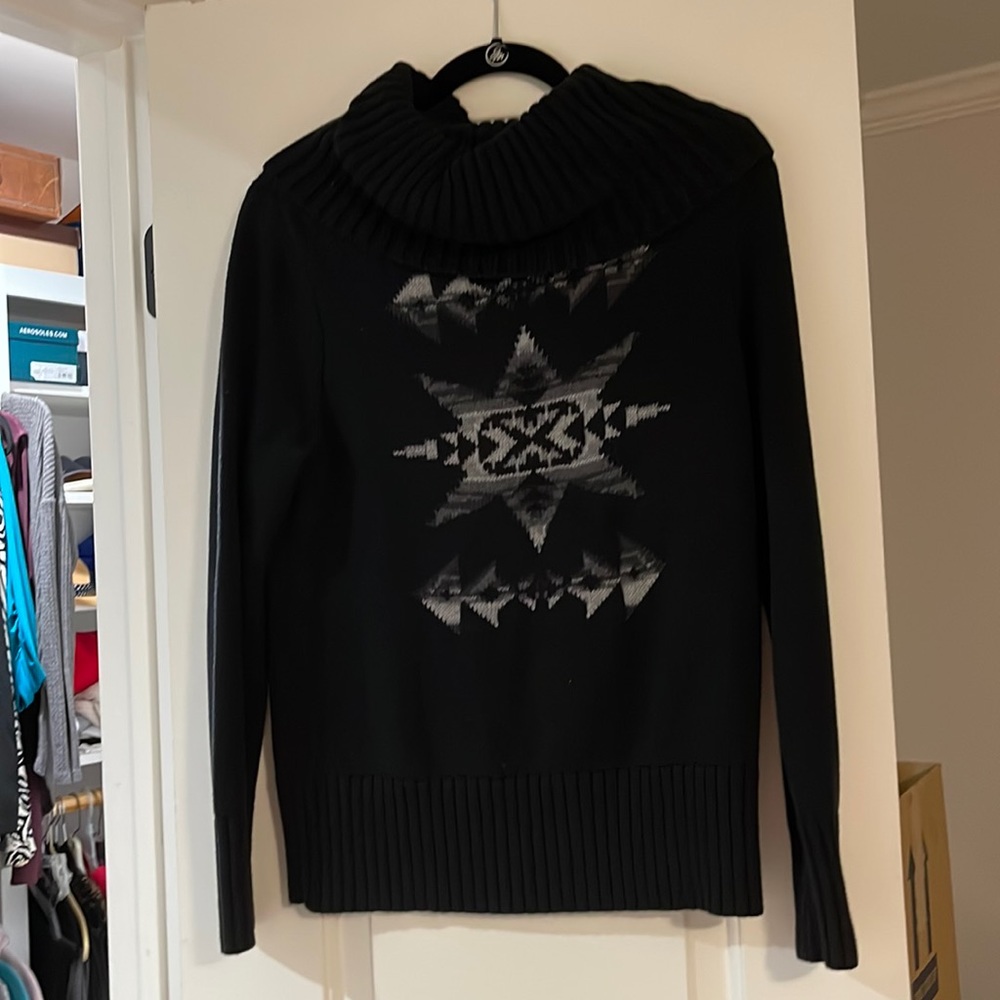 black sweater with light gray/ dark gray Arrows. Cow neck